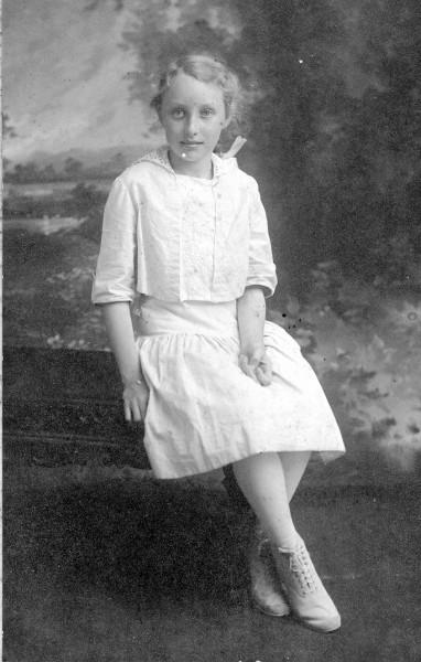 Young women dressed white named Thelma Nickerson